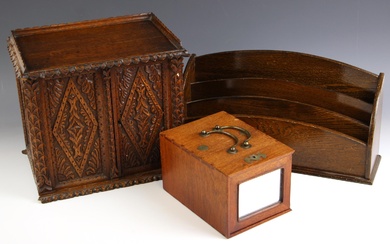 A Victorian carved oak stationery cabinet, the two doors ope...
