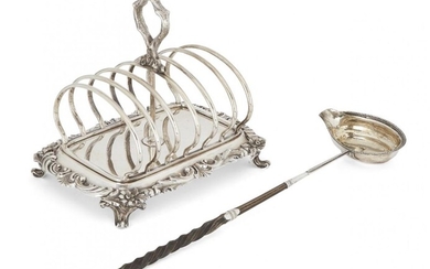 A Victorian silver toast rack, London, c.1840, Robert Hennell III, the six divisions centred by a stylised branch loop handle, the base with floral and scroll edge raised on four scroll feet, 19cm long, together with a silver toddy ladle with...