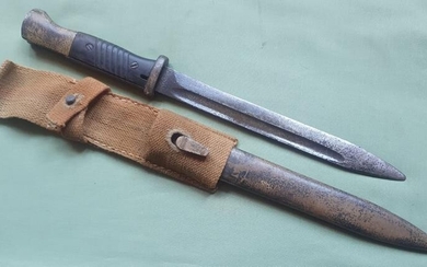 A WWII German bayonet, the pommel with Africa Korps...