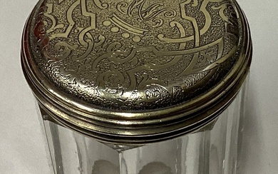 A William IV silver gilt and glass jar with bright-cut decoration.