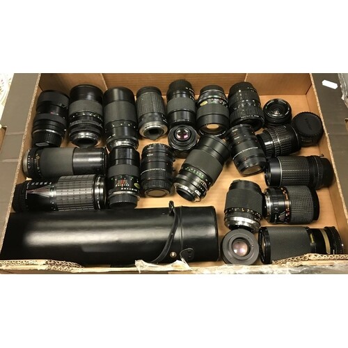 A box containing 22 various camera lenses including a Sigma ...