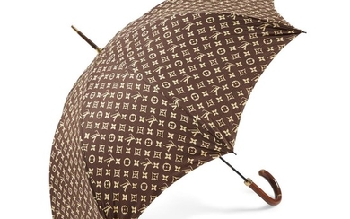 A brown and tan umbrella, Louis Vuitton monogrammed with...