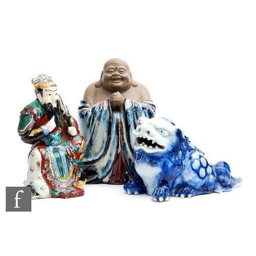 A collection of Chinese porcelain figures, to include a blue...