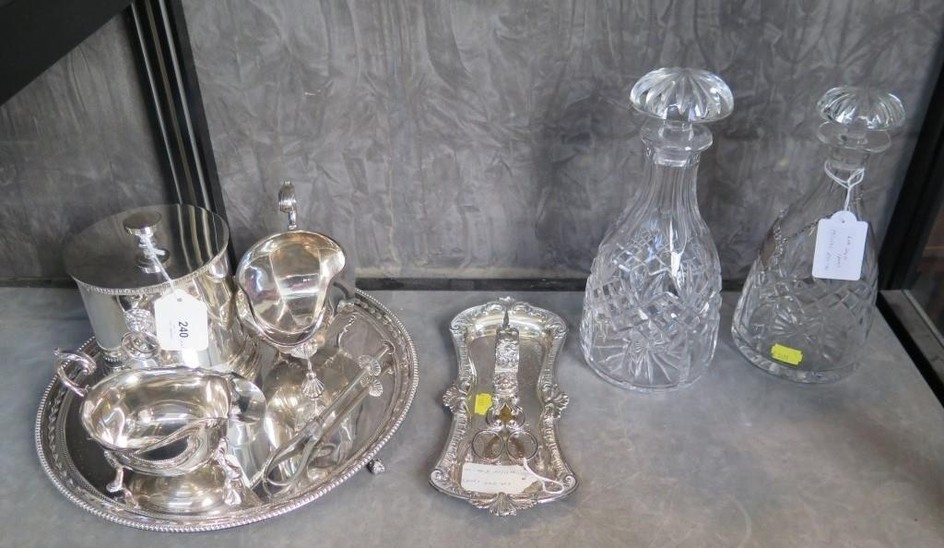 A collection of silver plate to include a candle snuffer and...