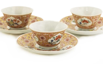 A collection of three Chinese famille rose tea cups and saucers