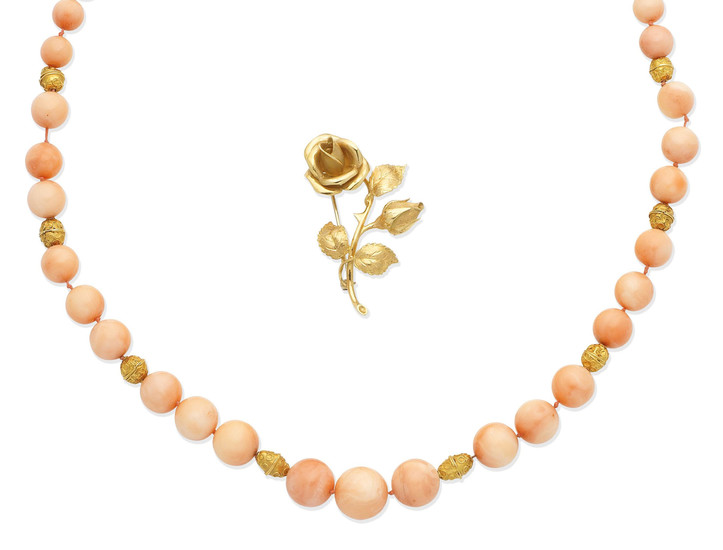 A coral bead necklace, and a rose brooch