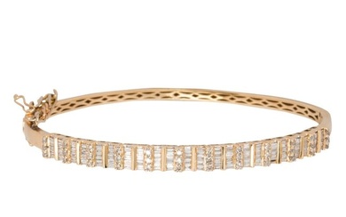 A diamond and 14k gold bangle bracelet
