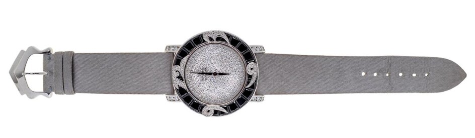 A diamond and onyx, quartz wristwatch, by Royal Diamond, ref. BA 80 S, the pave diamond dial with black enamel hands, signed The Royal Diamond, the bezel of calibre black onyx with applied diamond-set Arabic numeral quarters, and brilliant-cut...