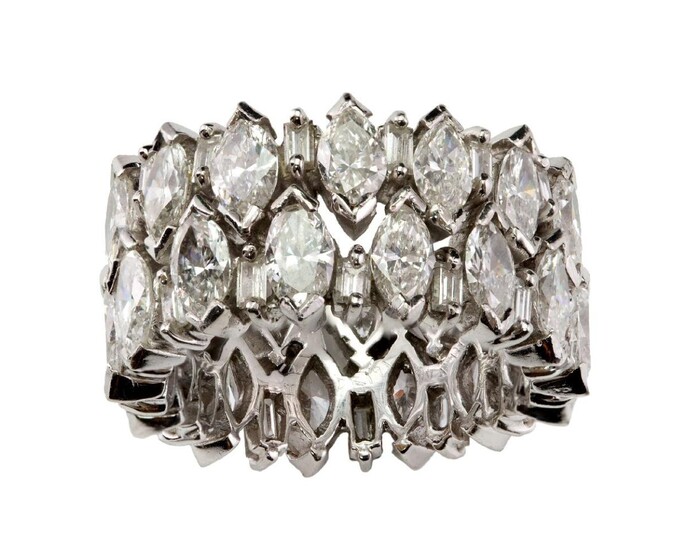 A diamond broad design eternity ring, attributed to Kutchinsky, claw-set with twenty eight marquise diamonds with baguette diamond two stone divisions, unsigned, with maker's case stamped Kutchinsky, ring size N