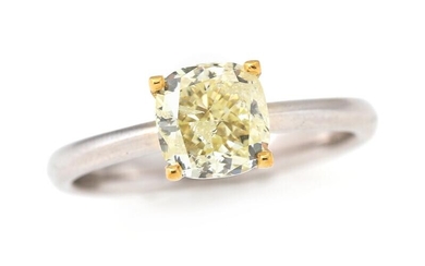 A diamond ring set with a cushion brilliant-cut fancy light Yellow diamond...