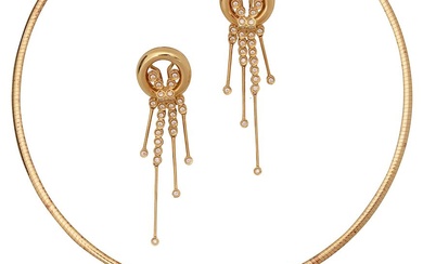 A diamond-set pendant and a matching pair of ear pendants