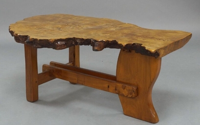 A free edge bur elm coffee table, late 20th Century, the solid burr elm cross section table top on square square and shaped supports, 45cm high, 110cm wide, 66cm deep