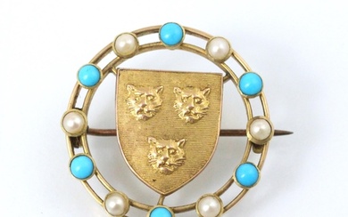 A gold coloured brooch, the circular brooch with paste pearl...