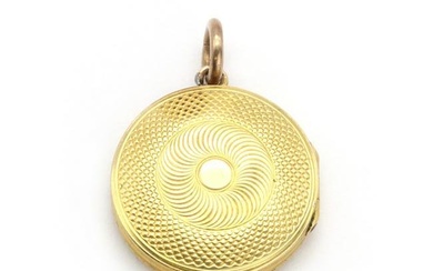 A gold memorial locket
