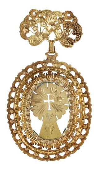 A gold pendant, Goa, Southwest India, late 17th-early 18th century, of openwork oval form, the central glass panel enclosing a gold sheet with cut out cross motif , the surrounding raised gold frame with concentric openwork bands, the attachment...