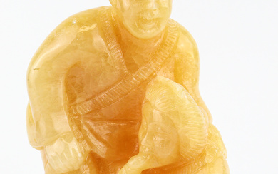 A large yellow jadeite carving of an amorous couple #...