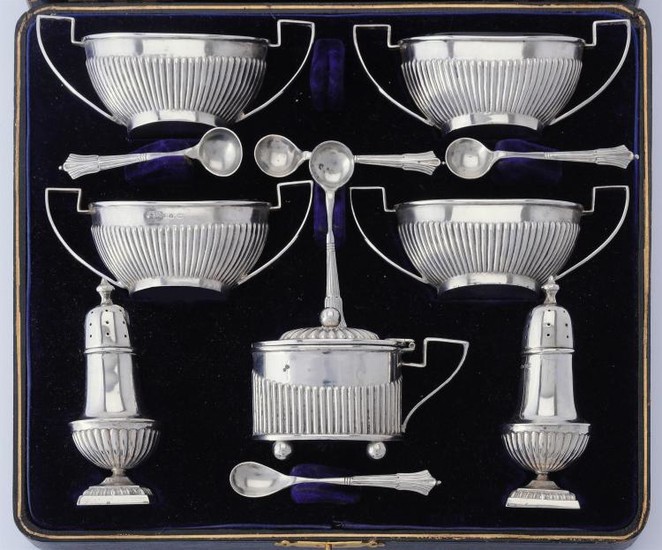 A late Victorian silver seven piece cruet set by Faraday & Davey