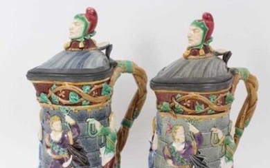 A matched pair of Minton Majolica 'Tower' jugs, 1881 and 1883, 33cm height