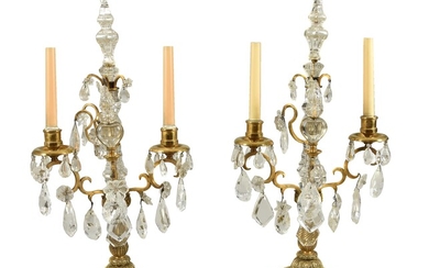 A pair of cut glass and rock crystal mounted gilt metal twin light candelabra in 18th century taste