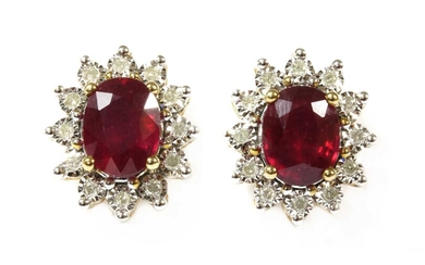 A pair of gold ruby and diamond cluster earrings