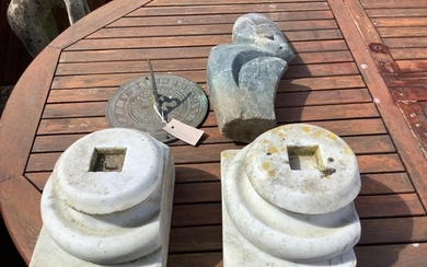 A pair of marble column bases, a sundial and a carved stone ...