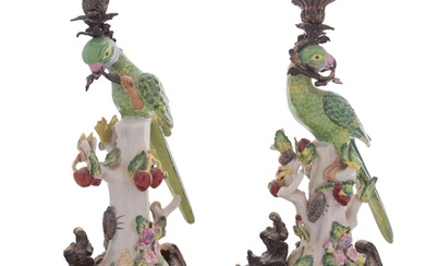 A pair of reproduction ceramic and gilt-metal mounted parrot...