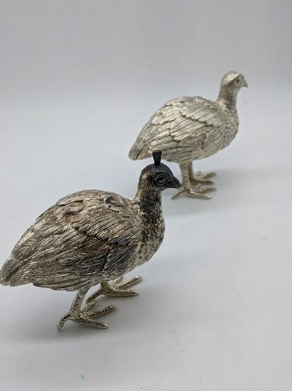 A pair of silver peacock ornaments, hallmarked London