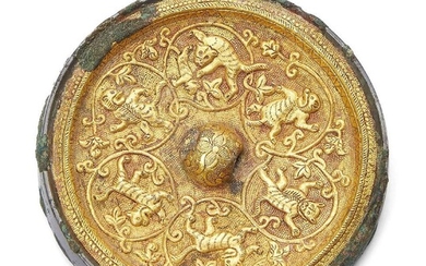 A rare Chinese bronze gold inlaid circular mirror, Tang dynasty,...