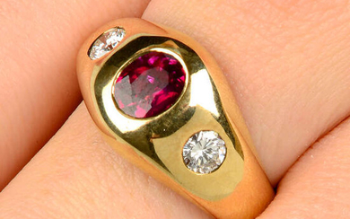 A ruby and brilliant-cut diamond three-stone ring.