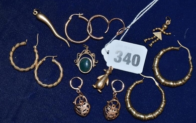 A selection of 9 ct gold earrings and charms,...