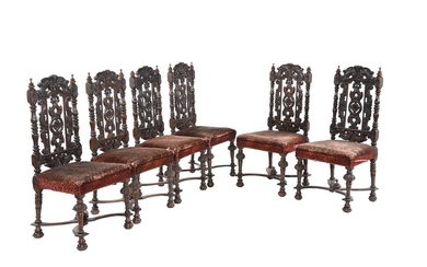 A set of six Victorian stained and carved oak dining chairs in Carrollian style