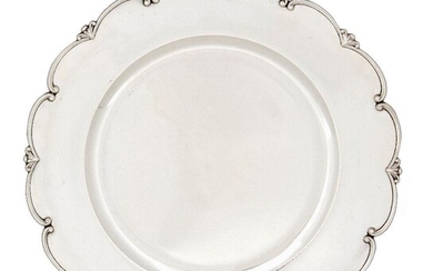 A set of twelve Italian dinner plates, Alessandria, 1944-1968, each stamped for 800 standard silver, of shaped circular form, the scrolling scalloped rims decorated with trefoil fan spacers, 29cm dia., total weight approx. 195oz (12)