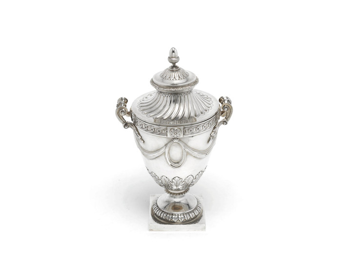 A silver cup and cover