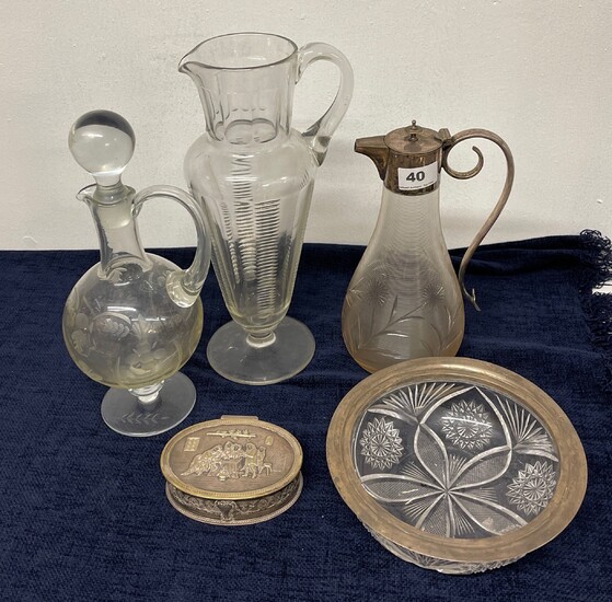 A silver rimmed cut glass bowl, a silver plate and cut glass claret jug, a Victorian cut glass jug, an etched decanter and a silver plated c