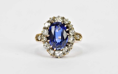 A yellow metal antique sapphire and diamond oval cluster ring...