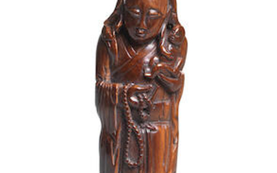 AN IVORY FIGURE OF GUANYIN AND CHILD