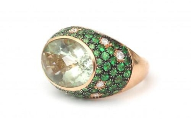 An 18 karat rose gold prasiolite, emerald and diamond cocktail ring. Featuring a central set prasiolite of ca. 7 ct. in a surround of pavé set emeralds and diamonds. Gross weight: 10 g.