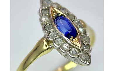 An 18K Yellow Gold Diamond and Sapphire Marquise Shaped Ring...
