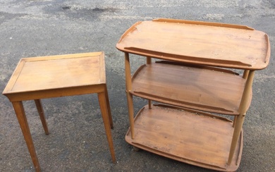 An Ercol elm three-tier trolley with rounded rectangular shelves on...