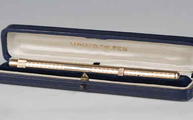 An Onoto 9ct gold cased fountain pen, London 1920, the nib detailed '14 Carat', within its