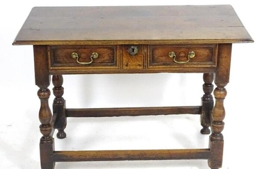 An early 18thC oak side table with an overhanging top