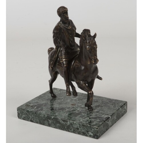 An early 20th century French patinated bronze equestrian fig...