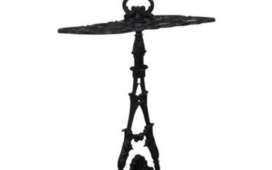 An early Victorian black-painted cast-iron stick stand, mid 19th century, after a design by W. Smee & Sons, with eight circular apertures, on a foliate and anthemion support and rectangular dished base, 67cm high, 48cm wide, 27cm deep