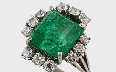An emerald, diamond, and eighteen karat white gold