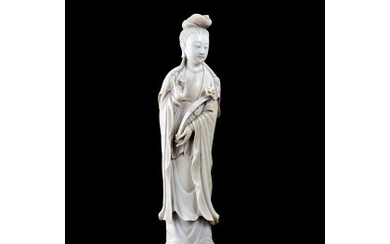 An ivory carving of a seated Guanyin on a double lotus flower China, 19th century (h. 25.4 cm.) This...