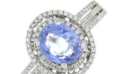 An oval-shape sapphire and brilliant-cut diamond