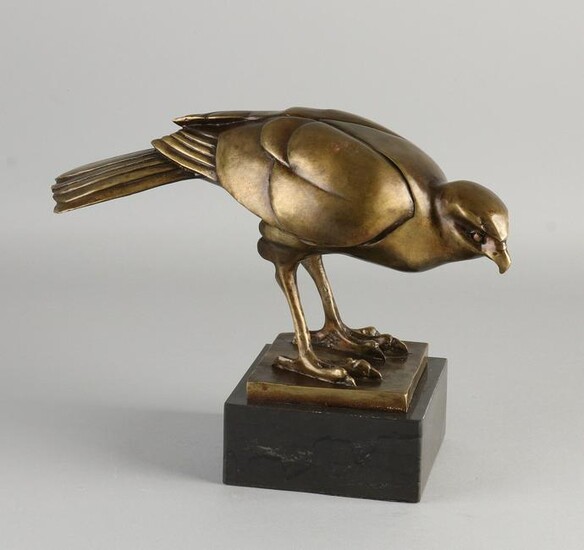 Art Deco style bronze bird of prey on black marble