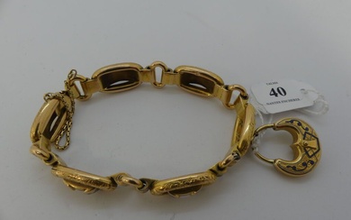 Bracelet articulé en or à 6 maillons émaillés et faux cadenas en pendeloque Poids: 26,6g...