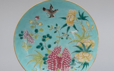 CHINESE FAMILLE ROSE PORCELAIN SHALLOW DISH Decoration of a bird amongst flowers on a turquoise blue ground. Six-character Jiajing m...