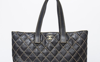 NOT SOLD. Chanel: A bag of black quilted leathet with gold tone hardware, two handles and one compartment with a button closure. – Bruun Rasmussen Auctioneers of Fine Art